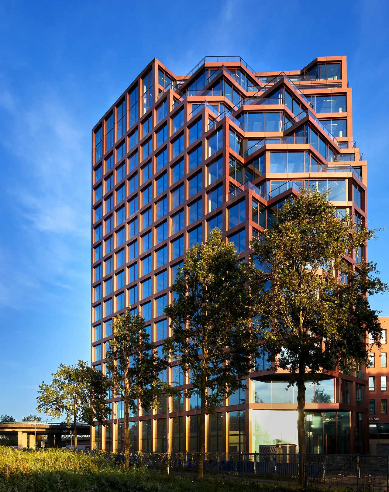 The full Orato tower with stepped copper terraces
